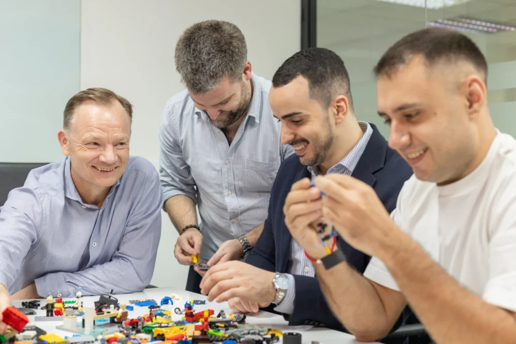 Team and CEO Building LEGO Corporate Gift