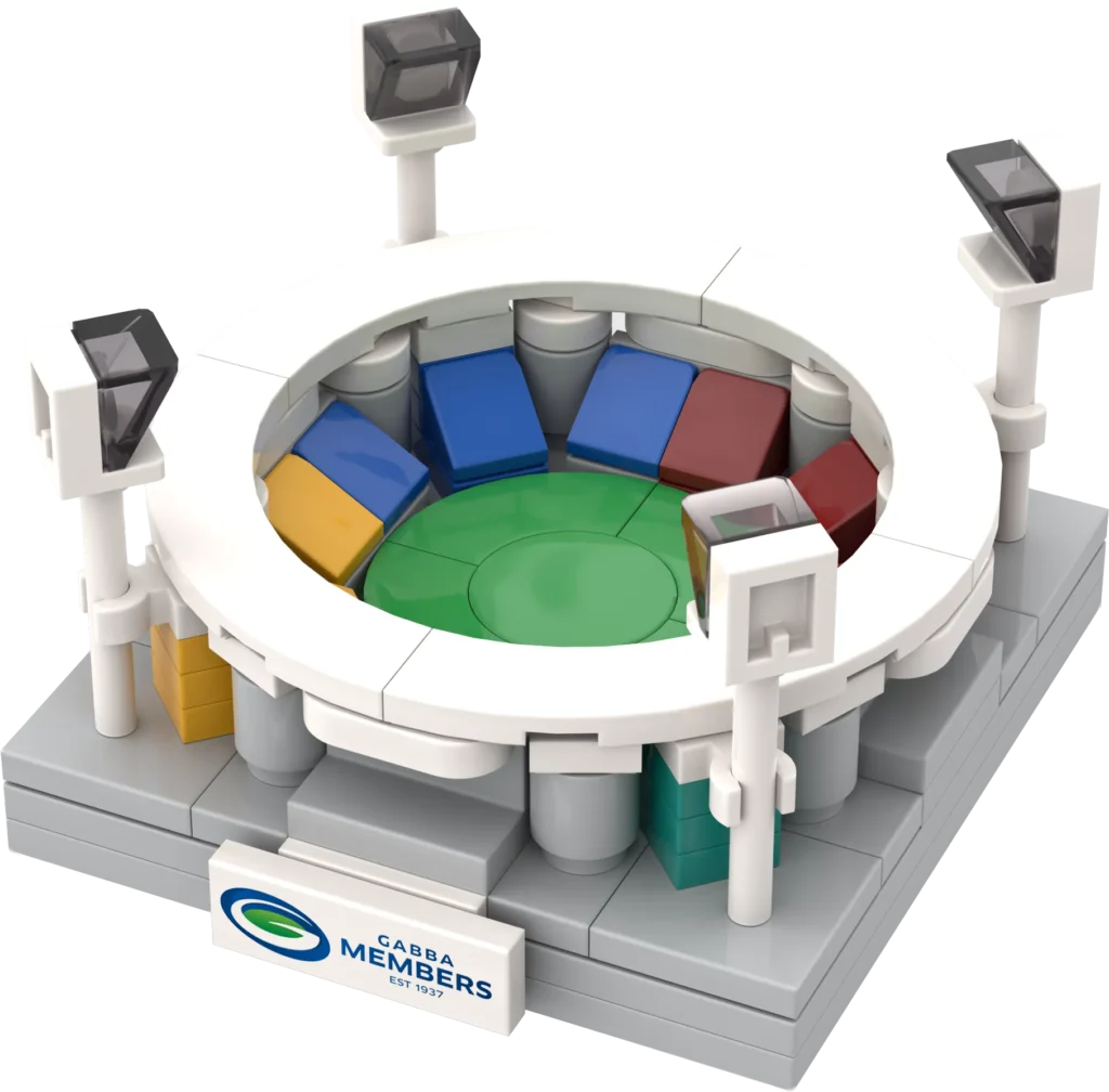 Circular white arena built from LEGO bricks, with a multicolored segmented floor (green, blue, yellow, orange, red) and a “GABBA MEMBERS EST 1937” sign at the front.